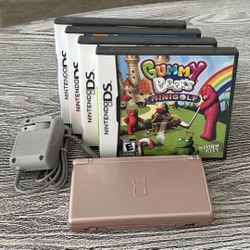 Metallic Gold Nintendo DS with 4 games, complete with stylus & charger. $65