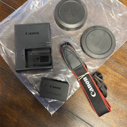 Canon EOS R100 Battery, Charger, Strap And Lens Covers