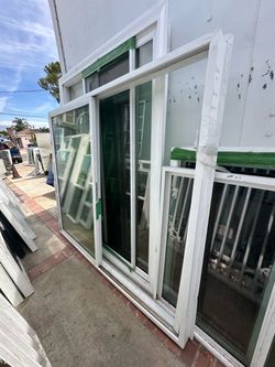 New construction white vinyl sliding glass door from DJ Windows & Doors. This unit has a  height of 80 inches  width of 95 inches. It is a double-pane