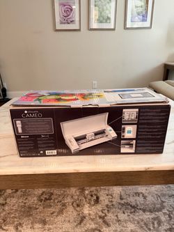 SILHOUETTE CAMEO 3; The Silhouette Cameo 3 is an electronic desktop cutting machine designed for DIY crafting, hobbyists, and small businesses. It fun