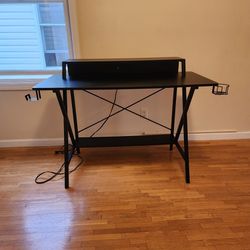 Black Desk With Power Cord And Outlets