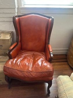 Orange genuine leather wingback chair 