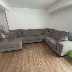 Gray Sectional With Three Pillows