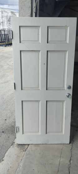 Exterior solid wood single door approximately 36 by 78.5