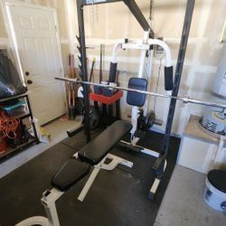 Weight Lifting Rack. Dumbbells, Bench, Weights, and Barbell