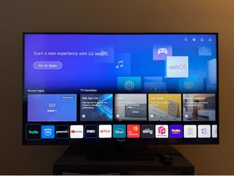 LG 55” 4K UHD Smart TV + Premium Swivel Stand - $180