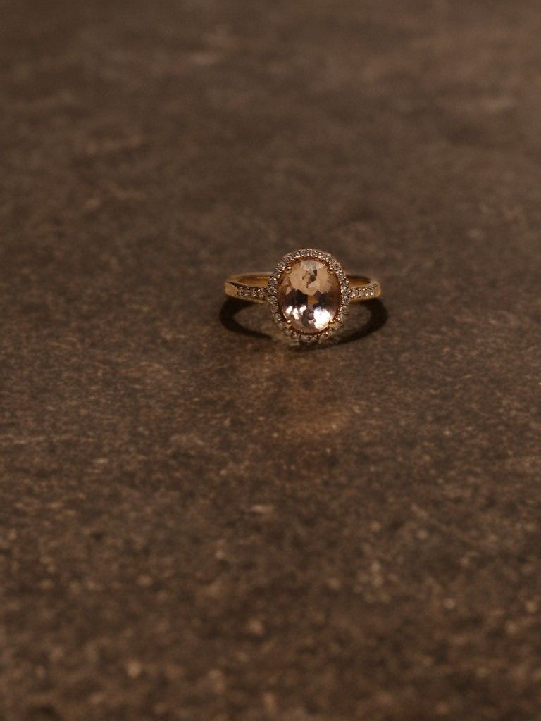 Stunning Oval Morganite and
1/5 CT. T.W. Diamond Frame Ring in 10K
Rose Gold