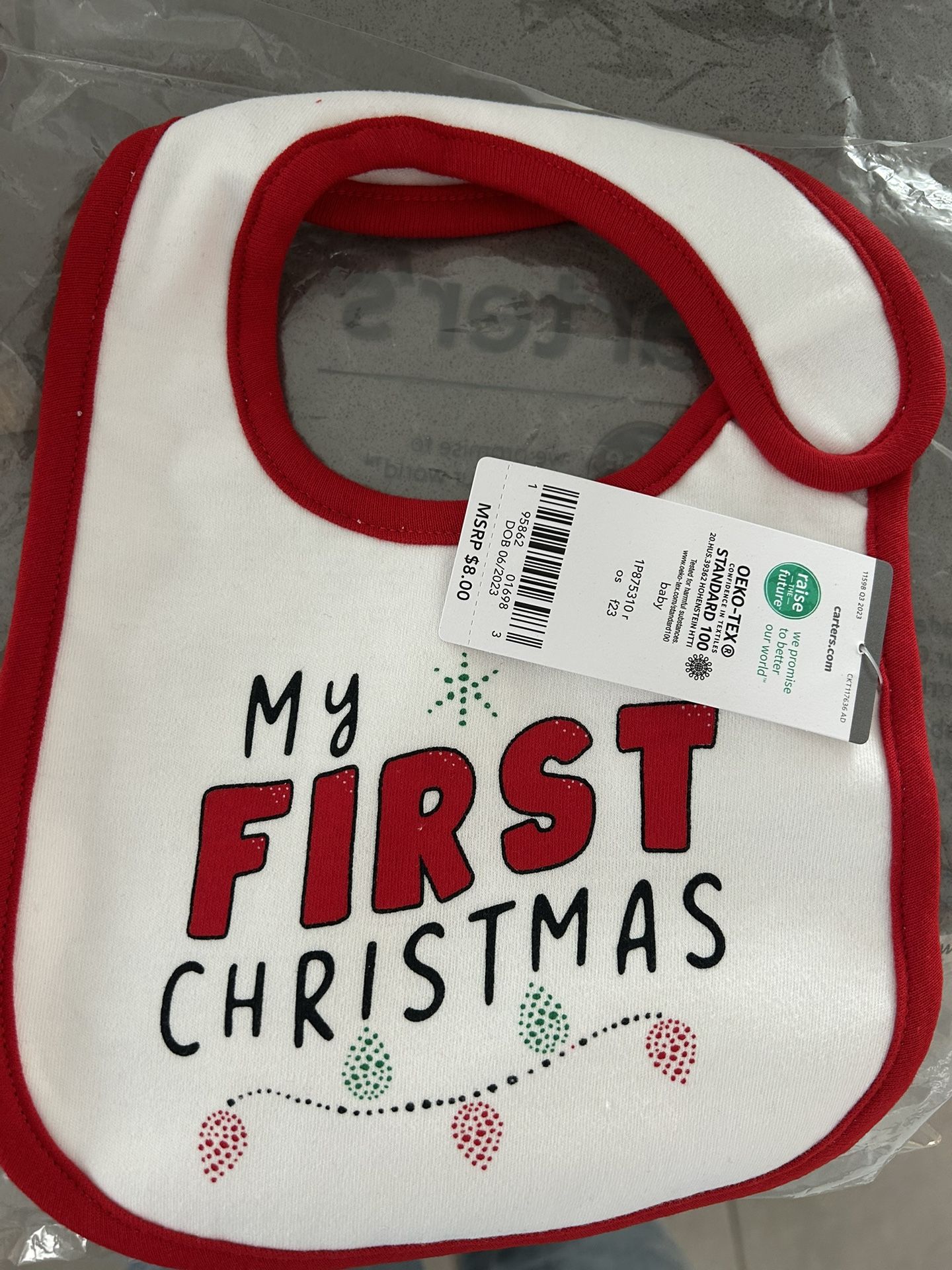 Brand new with tag Carter’s “My First Christmas” bib