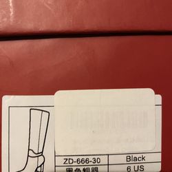  Black Woman knee high heeled boots 