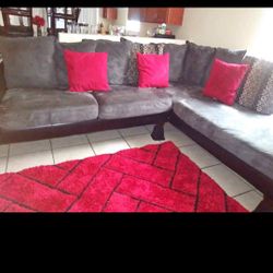 RAF Grey&black Sectional with red decor pillows to match