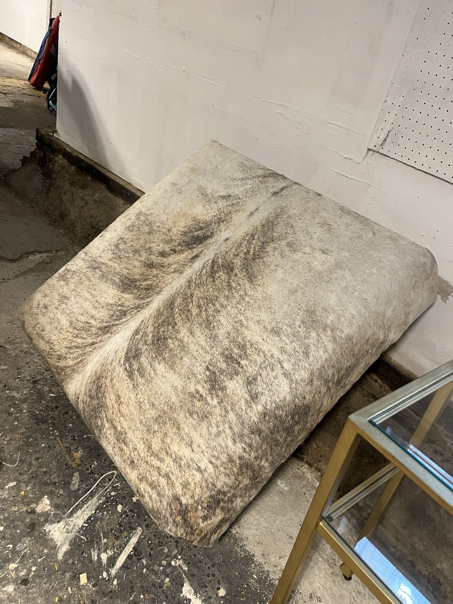 Ottoman: large hair on hide with stainless steel legs