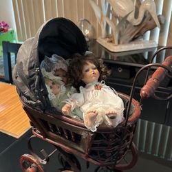 Antique Baby Carriage With Three Dolls