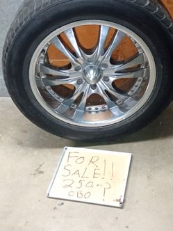 Tires and rims for a truck in good condition .