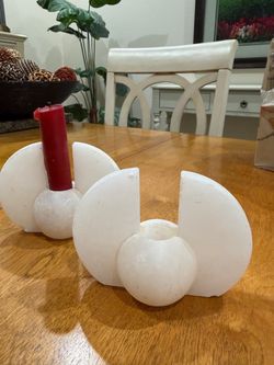 2 white marble accessories or candle holders