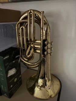 A used Gold olds marching Baritone