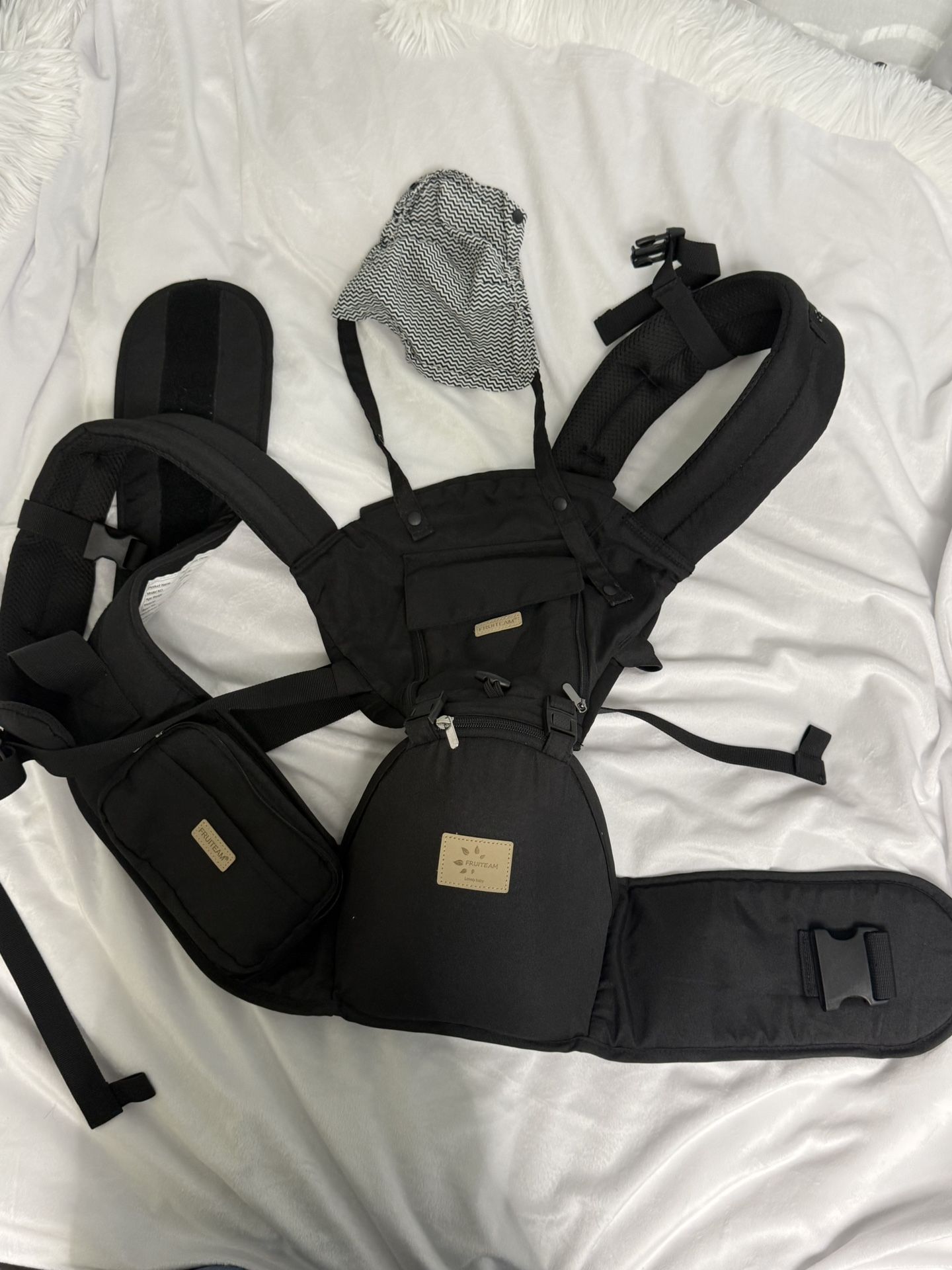 Comfortable and versatile black baby carrier for everyday use.  