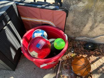 Bunch of outdoor toys and bin