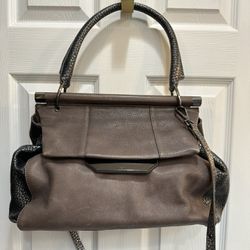 Grey and dark silver metallic top handle Halston Heritage handbag.