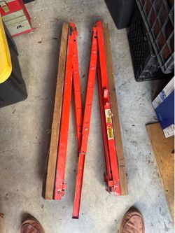Folding metal sawhorses