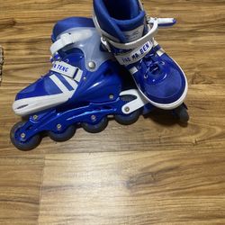 Blue roller blades, sz 6 yth/wmns