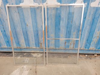 modern framed glass shower door panel with a polished chrome or aluminum finish.