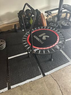 Kensone  Trampoline / Rebounder with an adjustable foam handlebar.