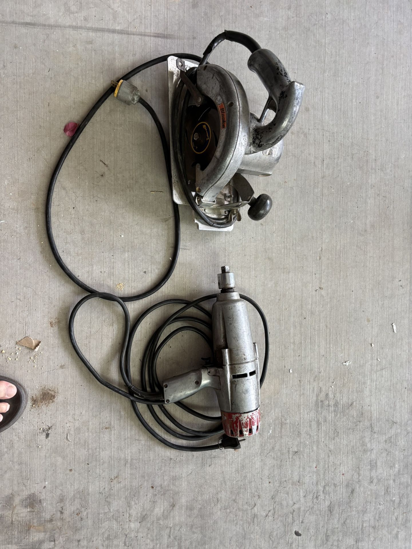 Old School Milwaukee Electric Impact Wrench And Black And Decker Circular Saw.