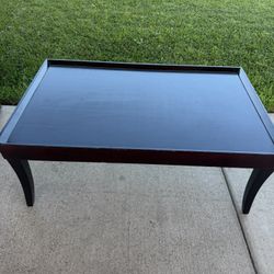 Dark brown wooden coffee table