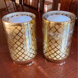 Pair of candles with holders 6 inches tall.