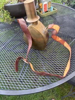 Vintage brass canteen with leather strap