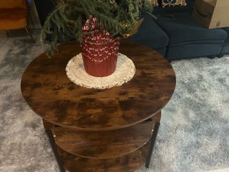 Round wood coffee table with shelves