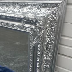 Large wooden framed silver bevelled mirror..  53” x 43” … $300