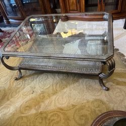 Metal and glass coffee table… with beveled glass… 47” wide , 34” depth , 20” high . $175 