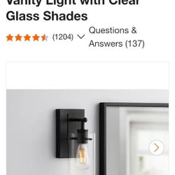 Hampton Bay
Regan 4.5 in. 1-Light Matte Black Bathroom Vanity Light with Clear Glass Shades