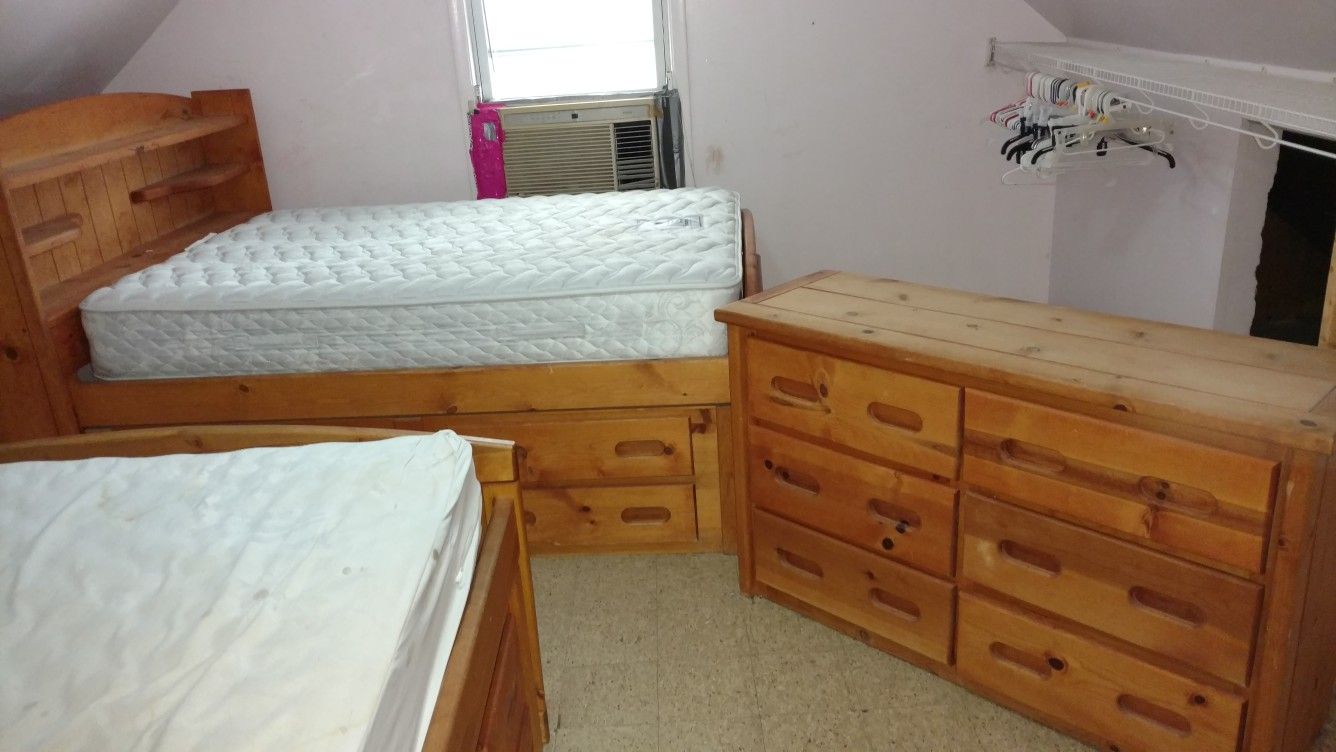 3 piece kids bedroom set with built in dressers in beds.