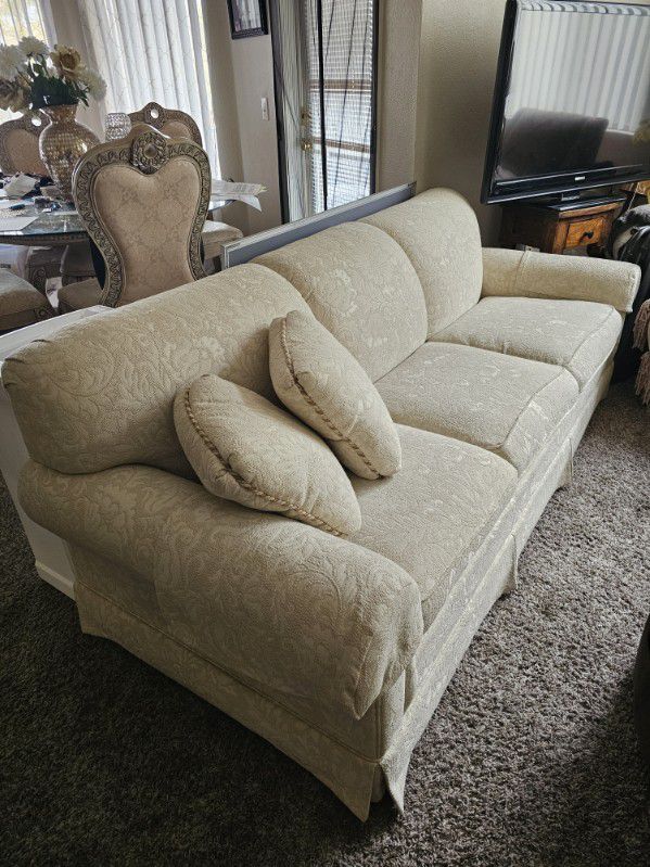 Cream Couch With A Pull-Out Bed