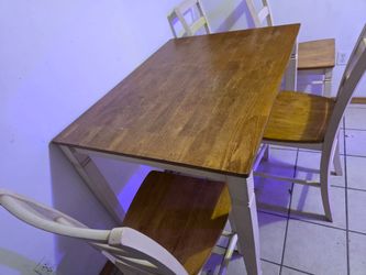 Table  and  4  chairs, wood,  48" x 36" ,   36" high