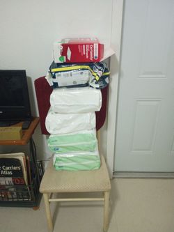 5 boxes of pull -ups pampers and a box of premium under pads