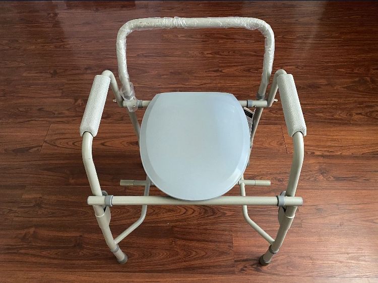 Stainless Steel Drop Arm Commode NEW