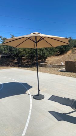 Outdoor umbrella with weighted stand. Brand new umbrella