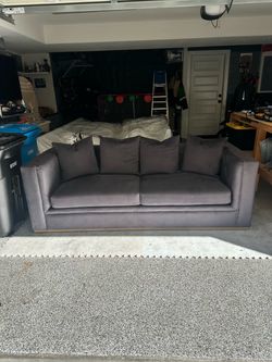 Like new Gray Upholstered Sofa with Gold Base