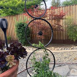 Industrial yard art garden trellis bicycle rims