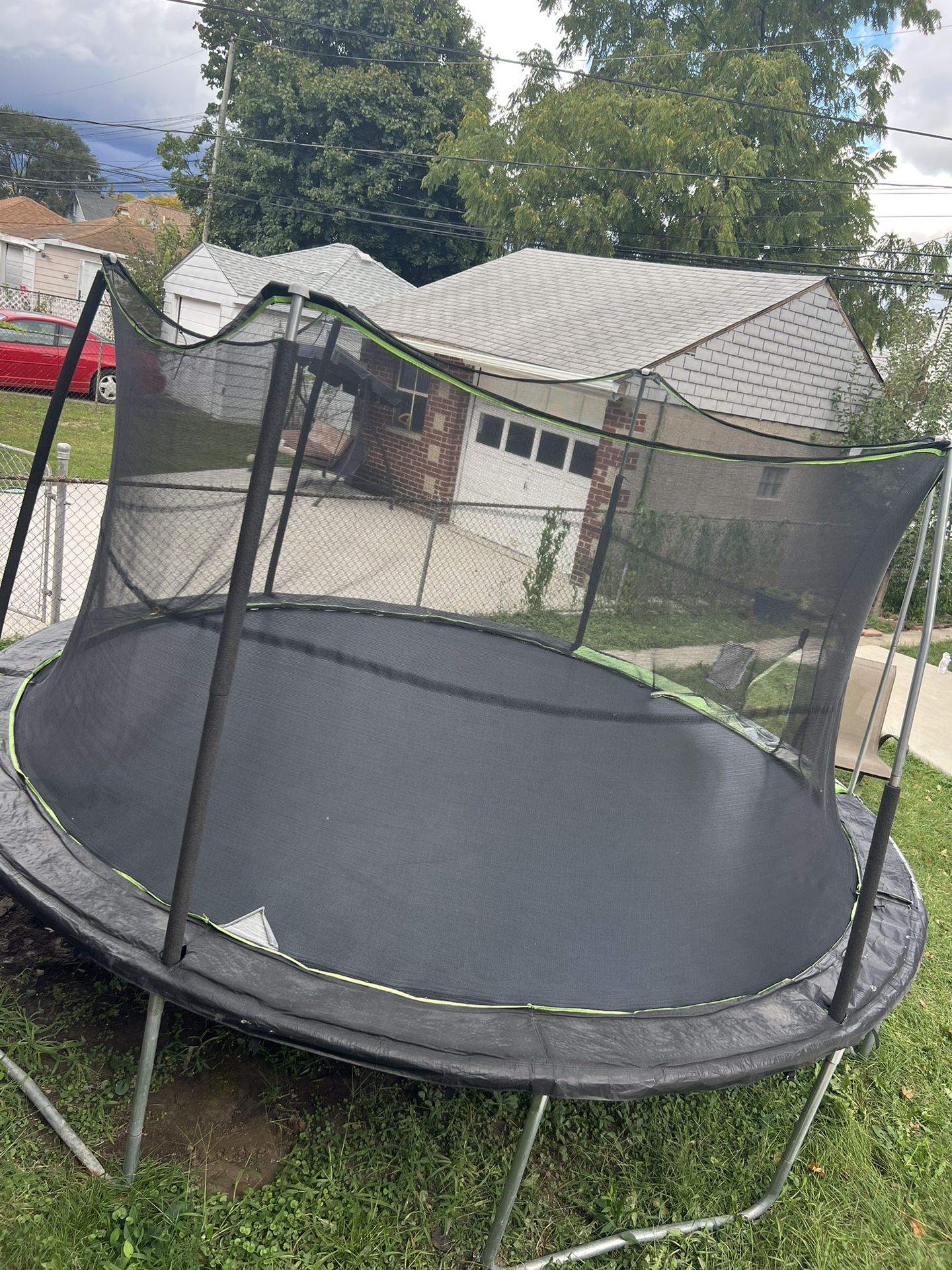 15 ft trampoline used fair condition, no zipper 
