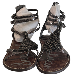 Stylish Sam Edelman gladiator sandals featuring black metallic crackle straps and bold beaded T-strap detail. Back zip closure with adjustable ankle b