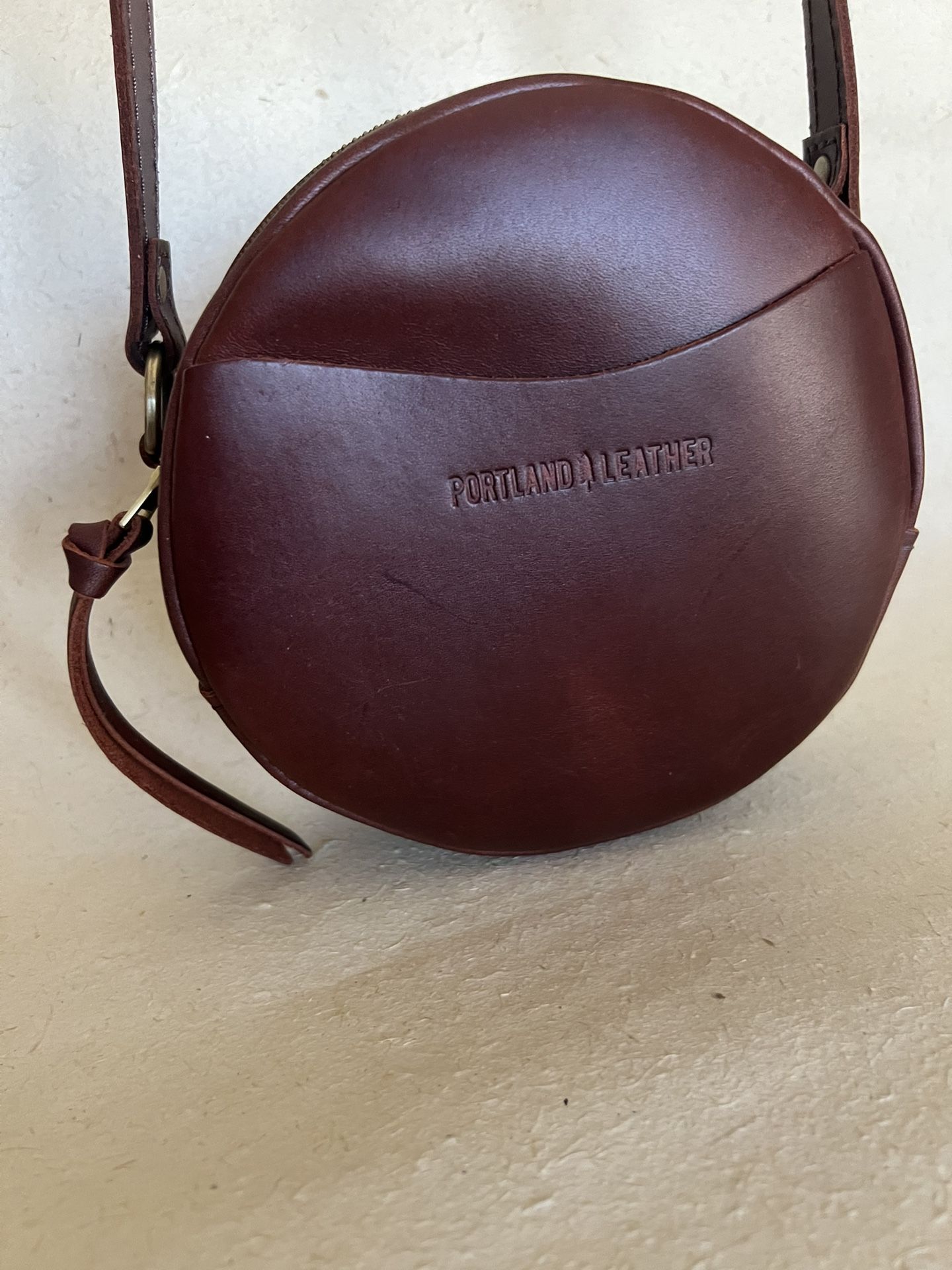 PORTLAND LEATHER GOODS BROWN ROUND CROSSBODY BAG