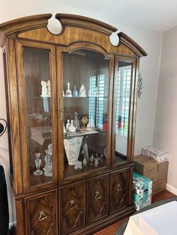 Thomasville Furniture china cabinet from the Serenade Collection, featuring a classic burled walnut