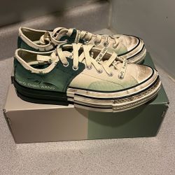 The Converse Chuck Taylor All Star 70 Ox Feng Chen Wang 2-in-1 Myrtle features a unique layered design with split soles and a gradient green colorway.