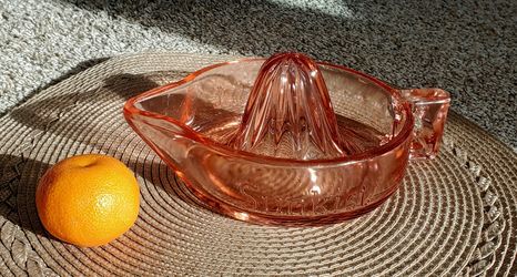 Pink depression glass Sunkist citrus reamer.