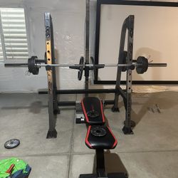 Weight Bench with Barbell and Weights