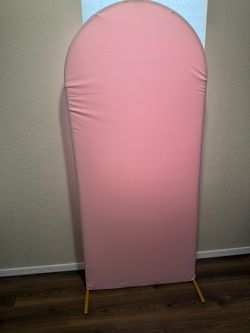 gold arch with and pink cover